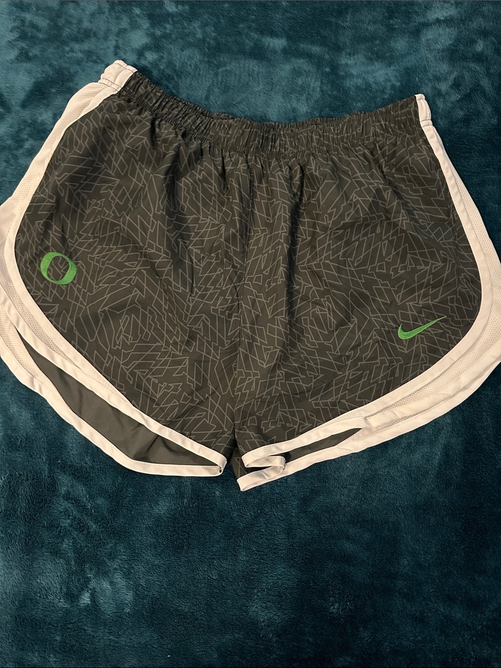 Nike Women's Dark Gray Athletic Shorts with White Trim and Green Accents